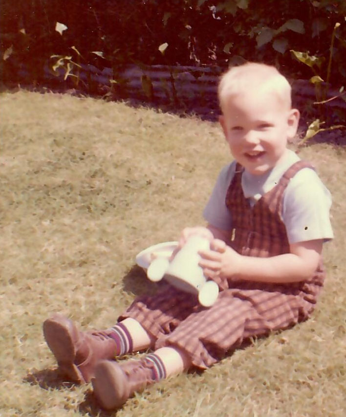 Boyd as a boy in the backyard